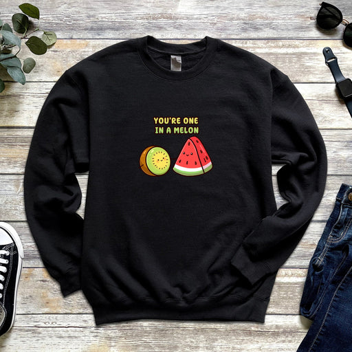 a black sweatshirt with a watermelon and a slice of pizza on it