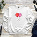 a white sweatshirt with two balloons on it