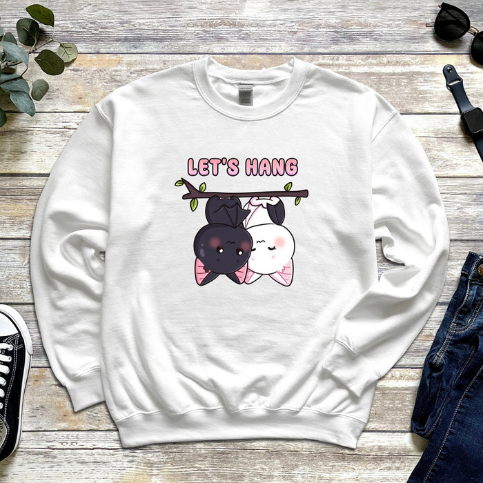 a sweatshirt with two dogs hanging on a tree branch