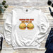 a white sweatshirt with two hamburgers on it