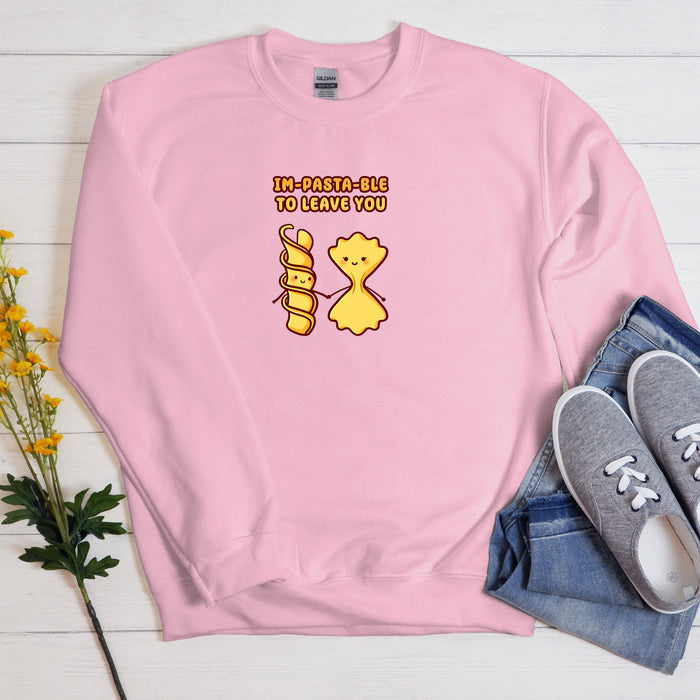 a pink sweatshirt with a yellow bear on it