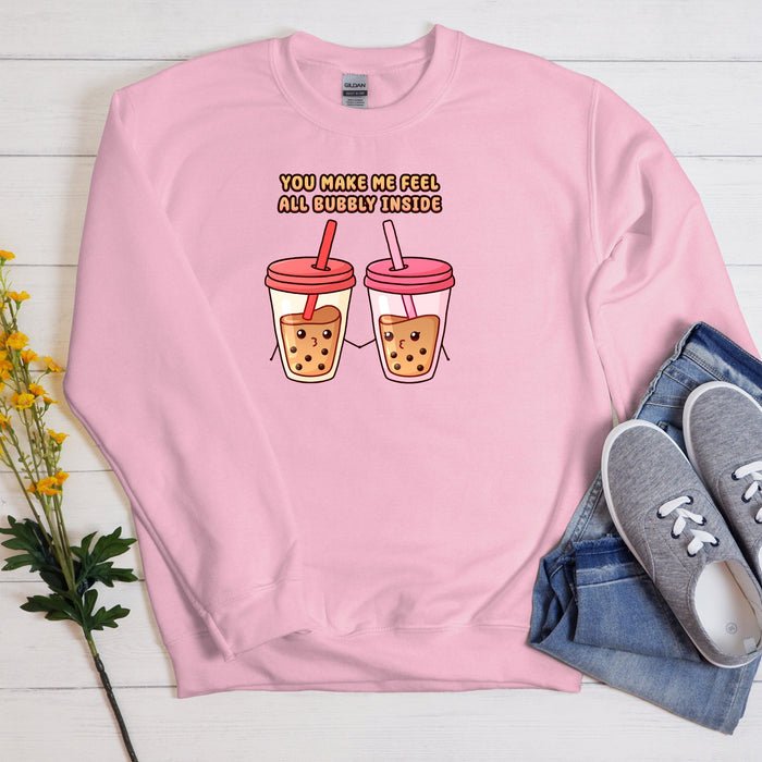 a pink sweatshirt with two cups of coffee on it