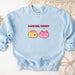 a blue sweatshirt with two donuts on it