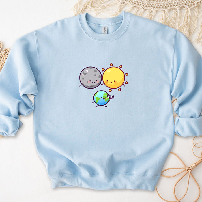 a blue sweatshirt with a picture of a sun and a planet on it