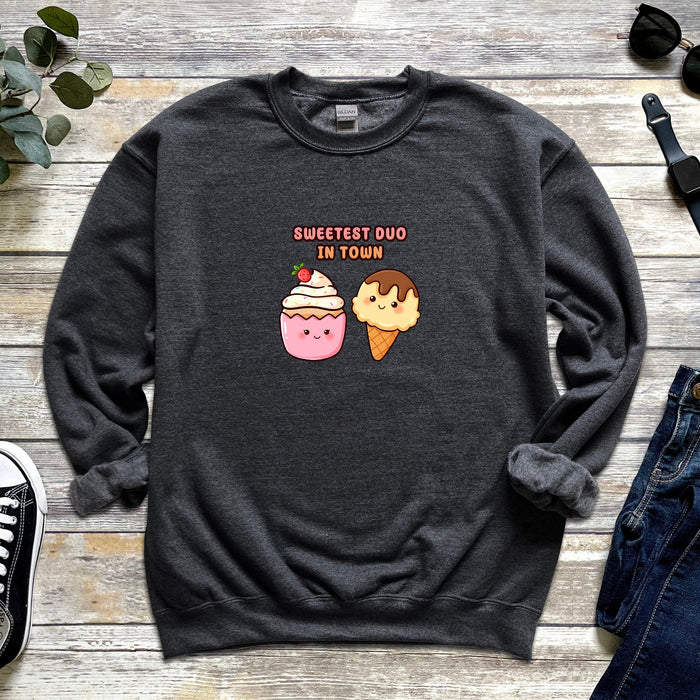 a sweater with an ice cream and a donut on it