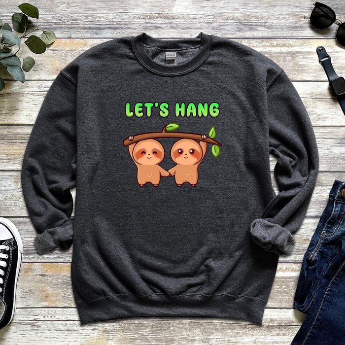 a sweatshirt with two slots hanging on a tree branch