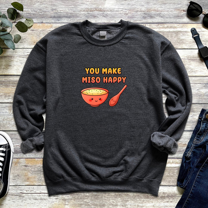a sweatshirt that says you make misso happy next to a pair of jeans