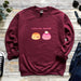 a red sweatshirt with two donuts on it and the words i love you,