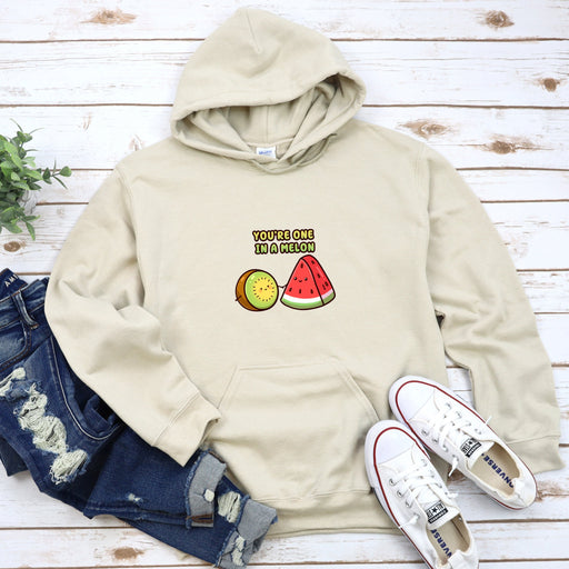 a white hoodie with a watermelon and a slice of watermelon