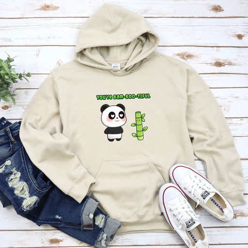 a white hoodie with a panda holding a green cactus