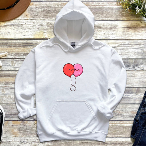 a white hoodie with a balloon drawn on it