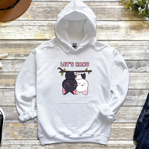 a white hoodie with two dogs on it