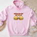 a pink hoodie with two hamburgers on it