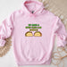 a pink hoodie with two tacos on it