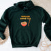 a green hoodie with a bowl of ramen - tics on it