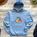 a blue hoodie with a watermelon and kiwi on it