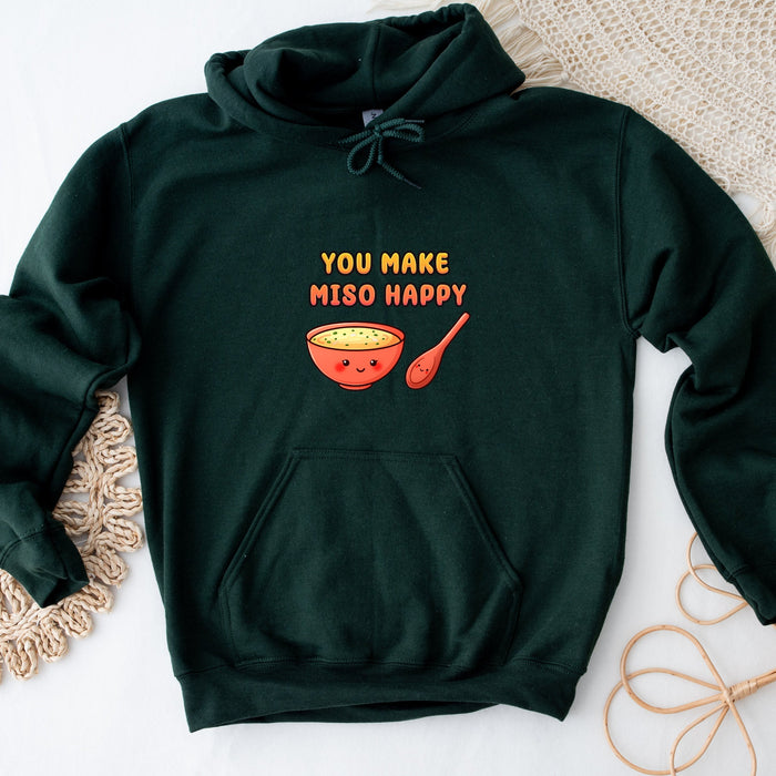 a green sweatshirt with a bowl of soup on it