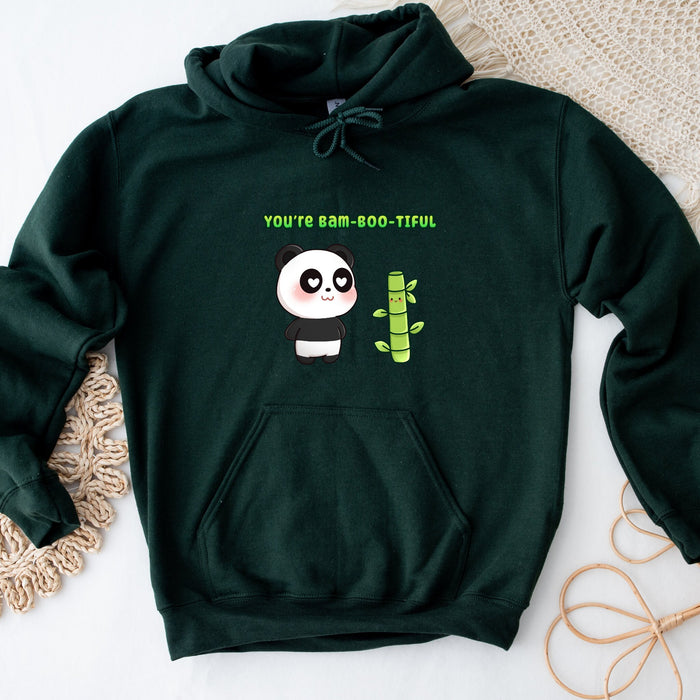 a green hoodie with a panda holding a bamboo stick