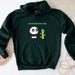 a green hoodie with a panda holding a bamboo stick