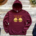 a maroon sweatshirt with a hamburger and bun on it