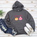 a gray hoodie with two poopies on it