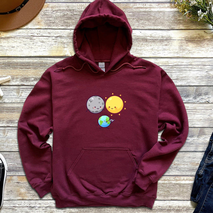 a maroon hoodie with an image of the earth and sun on it