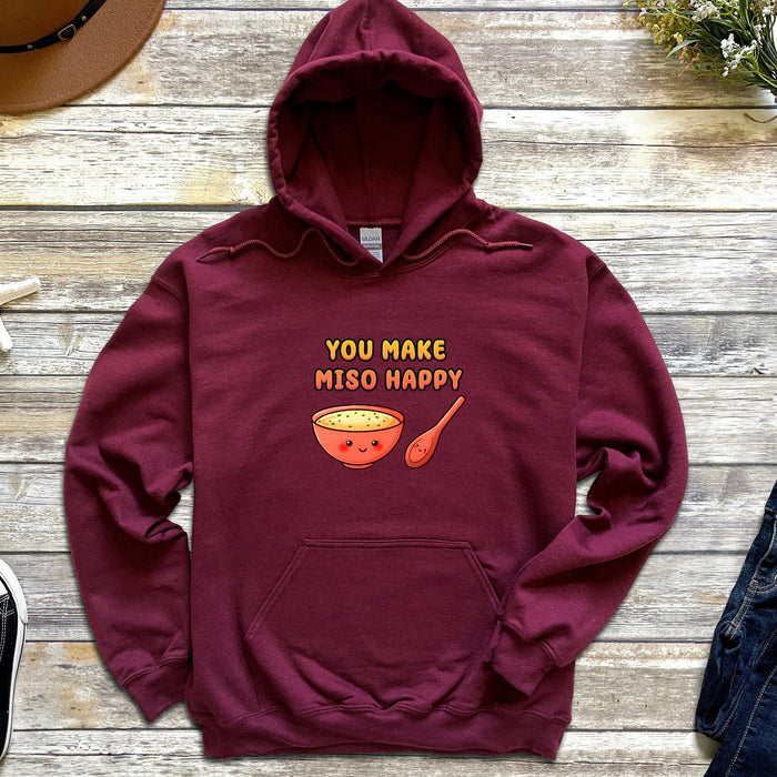 a maroon sweatshirt with a bowl of soup on it