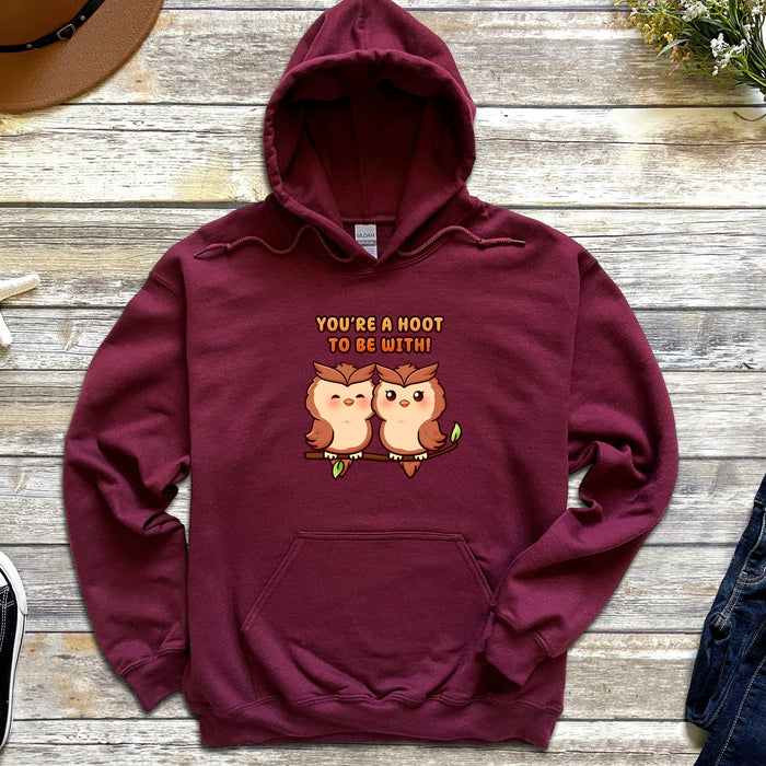 a maroon hoodie with two owls on it