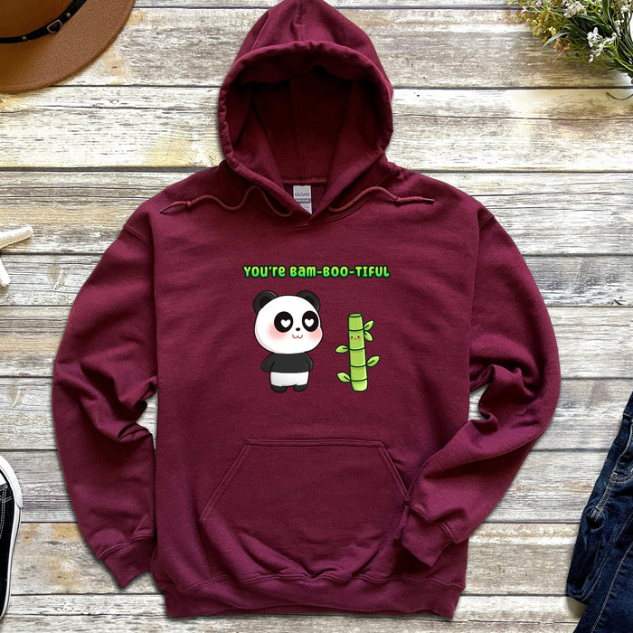 a red hoodie with a panda on it
