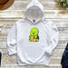 a white hoodie with a green turtle on it