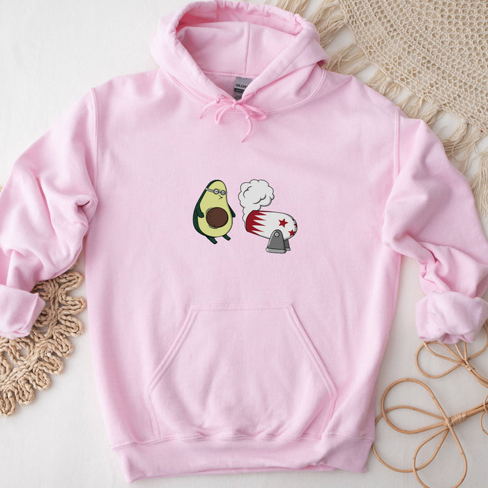 a pink sweatshirt with an avocado and an egg on it