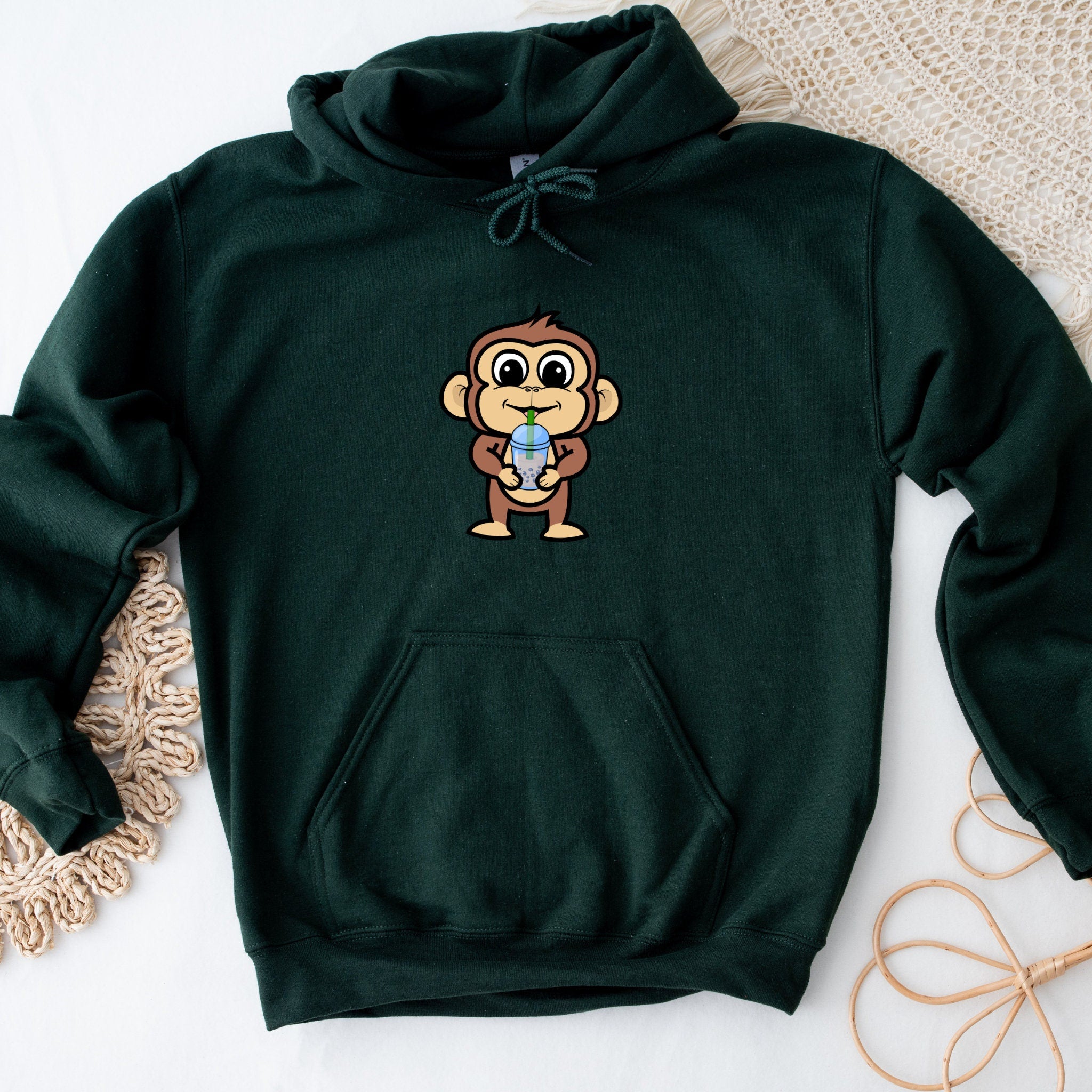 a green hoodie with a cartoon monkey on it