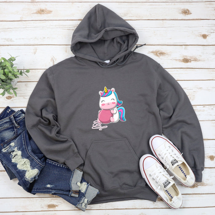a sweatshirt with a unicorn on it and a pair of jeans
