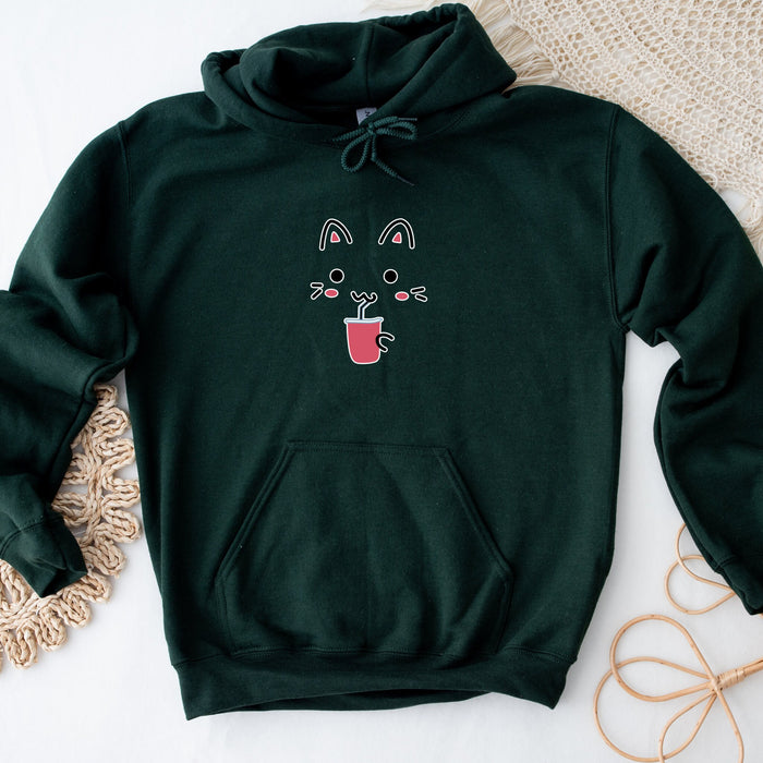 a green sweatshirt with a picture of a cat on it