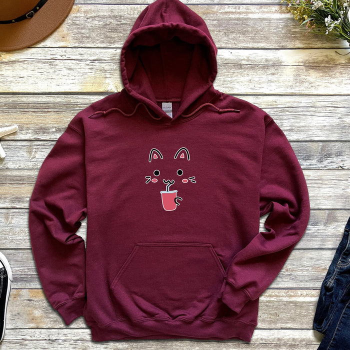 a maroon hoodie with a cat on it
