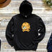 a black hoodie with a yellow leopard on it
