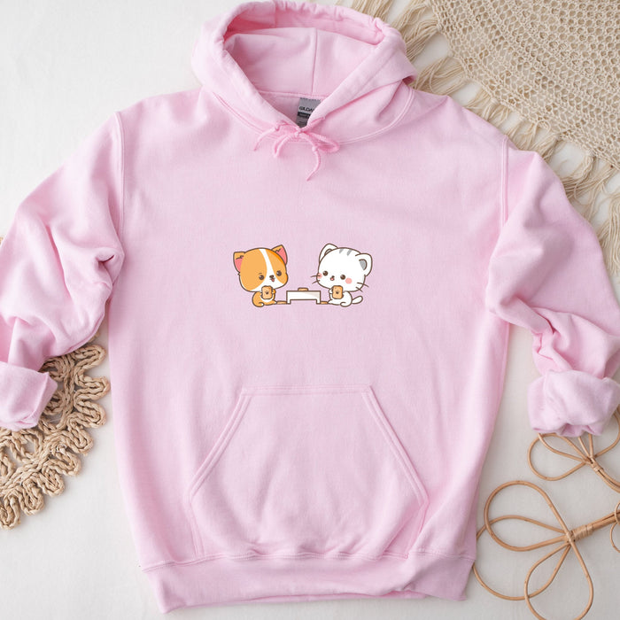 a pink hoodie with a picture of a cat and a dog on it