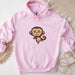 a pink hoodie with a cartoon monkey on it
