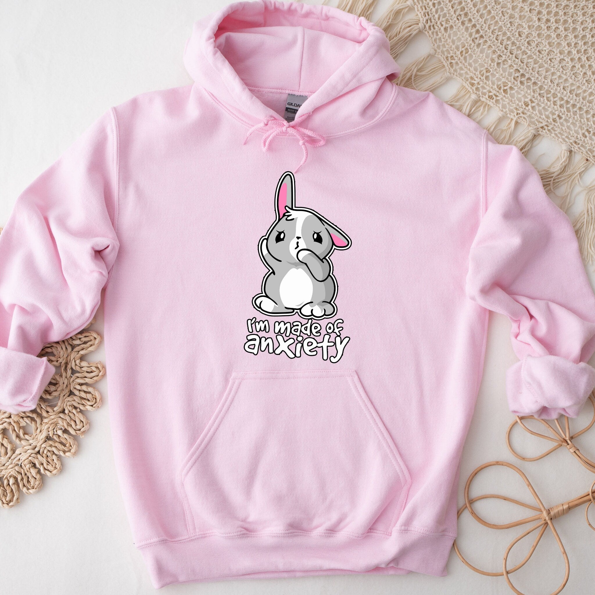 a pink hoodie with a cartoon bunny on it