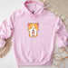 a pink hoodie with a corgi design on it