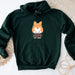 a green hoodie with a cartoon fox on it