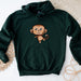 a green sweatshirt with a cartoon monkey on it