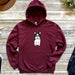a maroon hoodie with a picture of a dog on it