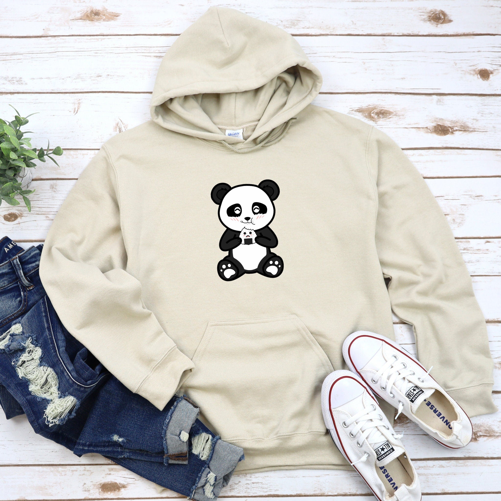 a white hoodie with a panda bear on it