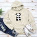 a white hoodie with a panda bear on it