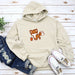 a white hoodie with a fox on it