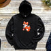 a black hoodie with a red fox on it