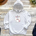 a white hoodie with a unicorn on it