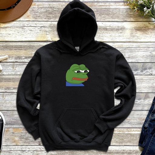 a black hoodie with a green frog on it