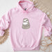 a pink hoodie with a cartoon of a slotty on it